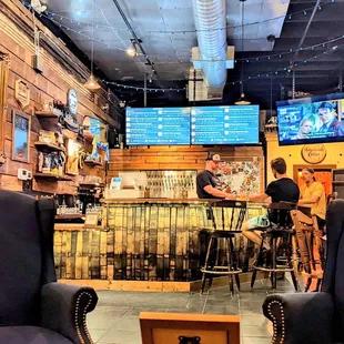 two people sitting at a bar
