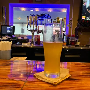a pint of beer on the bar