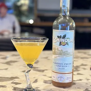 a martini and a bottle of wine