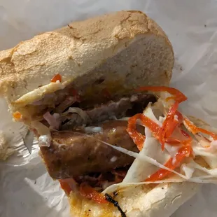 a sandwich with meat and vegetables