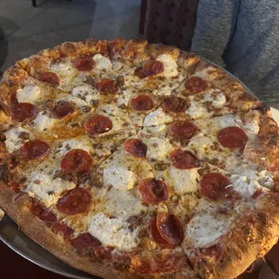 Large pizza with pepperoni, sausage and ricotta