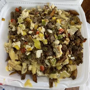 "Remix cheesesteak over fries"