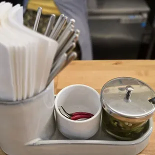 napkins, chopsticks and peppers