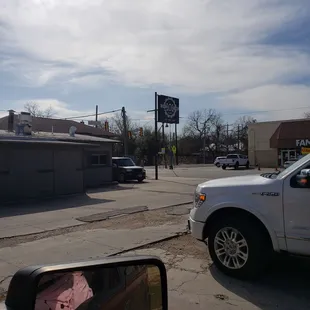a white pickup truck parked on the side of the road