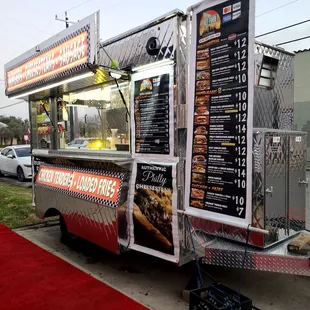 a food truck parked on the side of the road