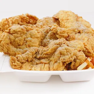 a fried chicken meal in a styrofoam container