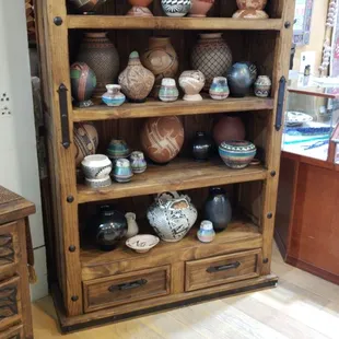 Rustic bookshelf with pottery