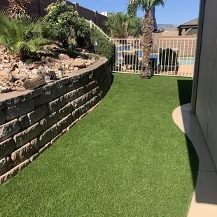 a backyard with artificial grass