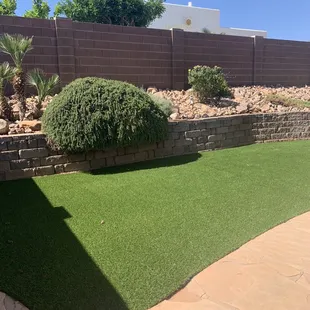 a backyard with artificial grass