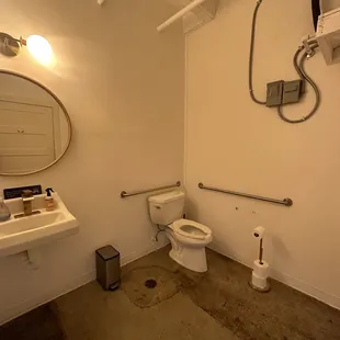a bathroom with a toilet and sink