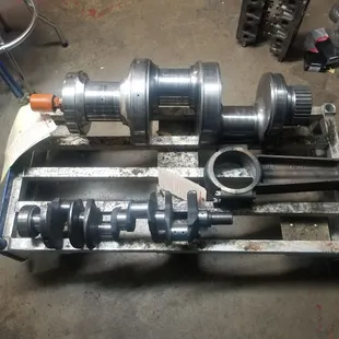 In house crank grinding! no job to big or small. Oilfeild pump shaft bext to a big block chevy for comparison.