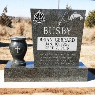Dark Cloud Gray Granite.  Special shape, with a turned floral vase.