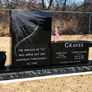 This memorial combines an upright monument with a bench monument.  Custom sandblast engraving