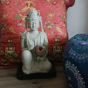 Goddess of Compassion Quan Yin holding agate sphere with crystal druzy opening