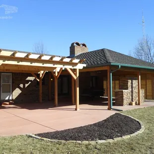 a patio with a pergol roof