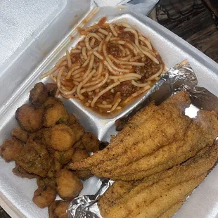 a tray of fried fish and pasta
