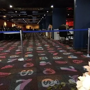 The roped off section. All the machines are gone. Just a pile of tables and chairs.