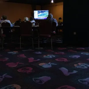 This is the West room. The back half has been roped off. There is ONE TV and some tables to watch the Breeder's Cup today.