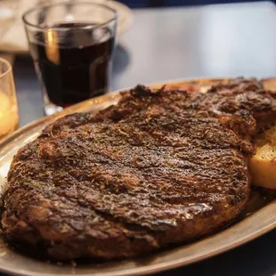 a steak and potatoes on a plate