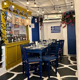 a dining area with blue chairs