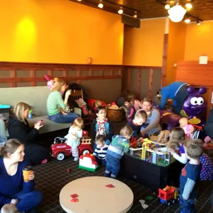 a large group of children and adults