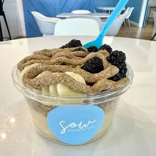 Sow smoothie bowl made with our peach base, house made granola, bananas, blackberries and almond butter