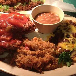 The South Texan - Chicken fried steak with ranchero sauce, cheese enchiladas, rice, beans, and tortillas.
