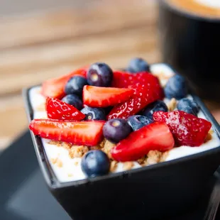 Yogurt Parfait with granola, strawberries, and blueberries