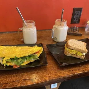Custom omelet with Swiss, spinach and tomato and egg sandwich on gluten free bread.