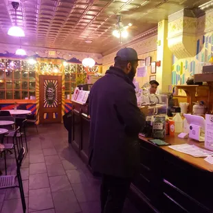 a man standing at the counter