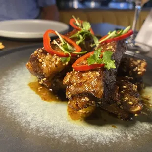 KOREAN BBQ RIBS - peanuts, scallions, sesame, pickled fresno peppers, cilantro