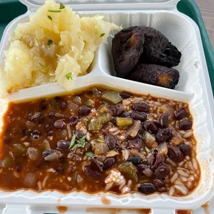 Rice, black beans, yuca and sweet plantains. The plantains were burned and the beans were acidic. The only good thing was the yuca.