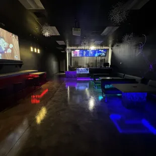a neon lit lounge area