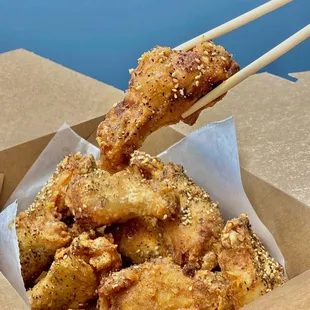 Deep fried chicken wing lightly coated with original blended starch.  The chicken is dipped into original sweet sauce after fried and season