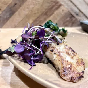 a plate of food on a wooden table