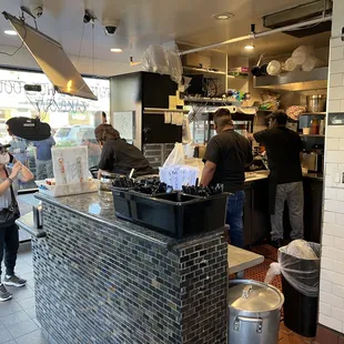 a group of people working in a restaurant