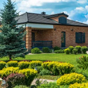 a brick house in a garden