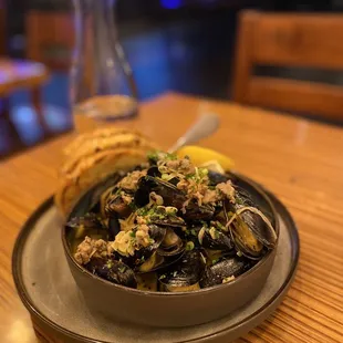 Prince Edwards Island Mussels $24.00 house sausage, allium, white wine, cream napa valley batard