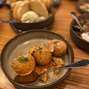 Arancini Verde $9.00 sun gold tomato, cherry tomato vierge, gouda, mozzarella, parmigiano reggiano, manchego