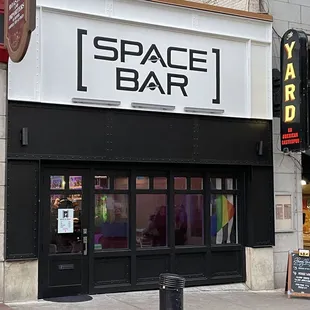 the entrance to the space bar