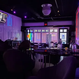 a bar with purple lighting