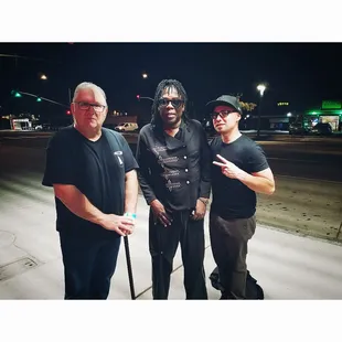 three men posing for a picture