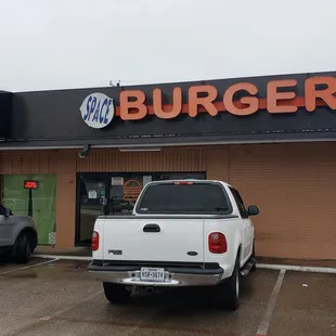 two trucks parked in front of a restaurant