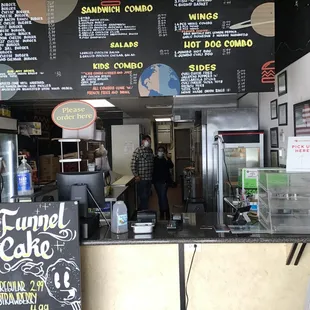 menus on the wall of the restaurant