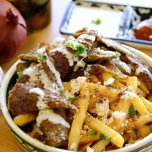 Try our Gyro fries, topped with tender Gyro strips and a hint of parsley and white sauce.