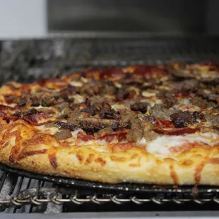 a pizza on a grill