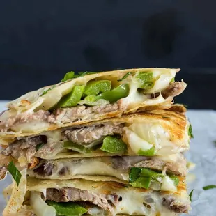 Steak Enjoy our mouth-watering Steak and Chicken Quesadilla, made with tender steak and/or juicy chicken, sautéed onions, green peppers, mus