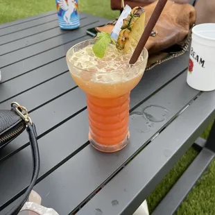 a drink on a picnic table