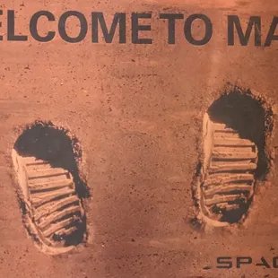 Mat on the floor by the tablet controlled robot room.