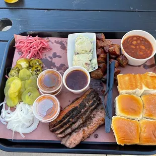 a tray of food on a picnic table